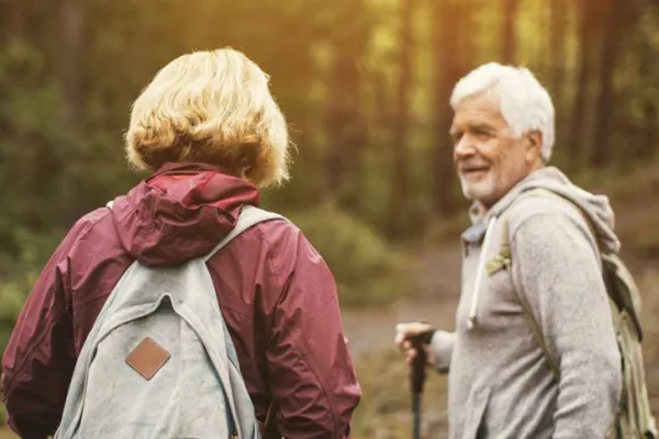Active adults enjoying an outdoor hike in the woods